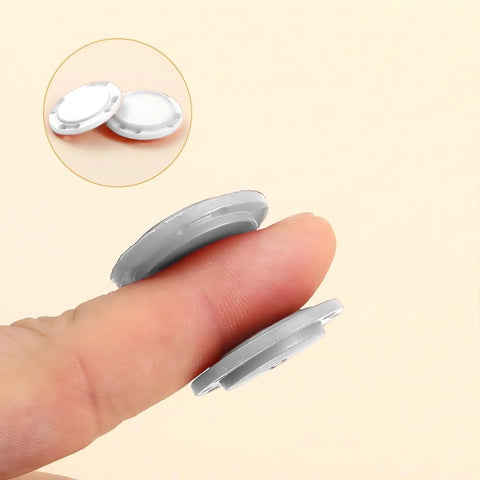 5 Pack Invisible Magnetic Snap Buttons For Apparel 26 Mm Sewing Snaps With Killer Hidden Magnets Easy Peasy Application For Jackets Coats Curtains Luggage And Sleepwear Top Shelf Nylon Base Clean White, close-up of two snaps held between fingers.