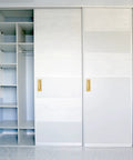 6 Inch Recessed Finger Flush Door Pulls For Pocket And Sliding Barn Doors In Brushed Gold Stainless Steel installed on white sliding closet doors