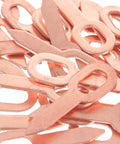 Close-up of copper components from Dent Puller Ring Kit For Auto Body And Sheet Metal Repair 200 Piece Set With Precision Shaping