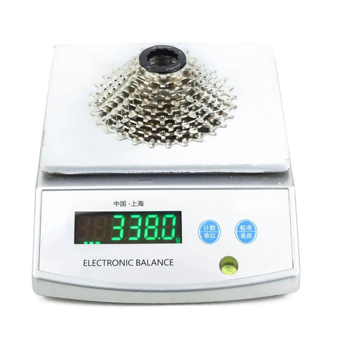 Nickel plated 10 Speed Bicycle Cassette for Mountain and Road Bikes 11 28T to 11 46T on electronic scale showing 338 grams