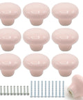 Top Tier Pink Ceramic Cabinet Knobs That Totally Level Up Your Kitchen Or Bathroom Easy Install With Matching Screws Sweet Round Drawer Pulls For Furniture Makeovers - Pack of 10 glossy pink knobs with matching screws.