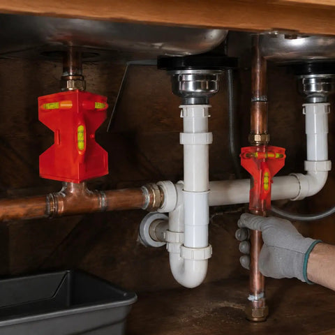 Spirit Level, Foldable, Adjustable Angle Pipe Corner Gauge in use for plumbing, with copper and PVC pipes visible.
