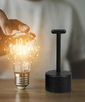 Slick Eight Piece Light Socket Ring Remover Plastic Wrench Set G9 E14 E26 E27 Bulb Base Adapter next to a light bulb.