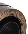Close-up of a rolled Chrome Plated Drill Press Return Spring Set For Bench, Horizontal, And Vertical Drills, robust spring steel.