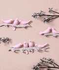 Five Hook Wall Mounted Coat Rack With Decorative Bird Design Built To Hold Heavy Gear Smoothly Perfect For Entryway And Bedroom Storage To Keep Your House Neat And Seriously Slick In Blue with pink bird motifs.