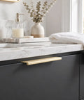 10 Pack Slick Brushed Gold Finger Edge Drawer Pulls Featuring Smooth Hidden Grip and Heavy Duty Zinc Construction For Quick Cabinetry Makeover Includes All Mounting Hardware For Fast Setup on dark cabinet.