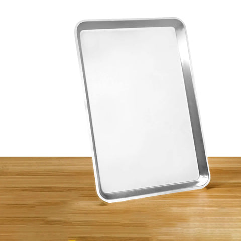 Heavy Duty Commercial 13 X 18 Half Size Aluminum Sheet Pan And Bun Tray With Sturdy Tapered Sides on wooden surface.