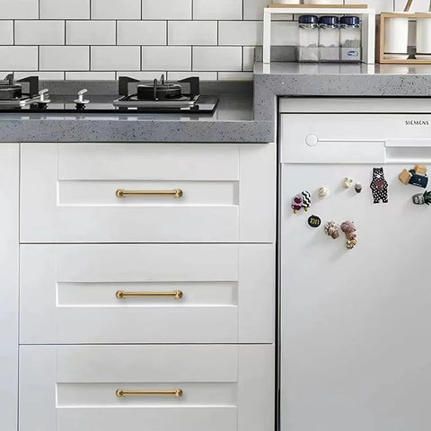 Image of 10 Pack Of 5 Inch Hole Center Champagne Bronze Cabinet Pulls on modern kitchen drawers with white cabinetry.