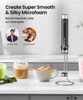 LunaFro Art Rechargeable Handheld Milk Frother With No Steam Wand Stepless Speed Control on counter beside foamed drinks.