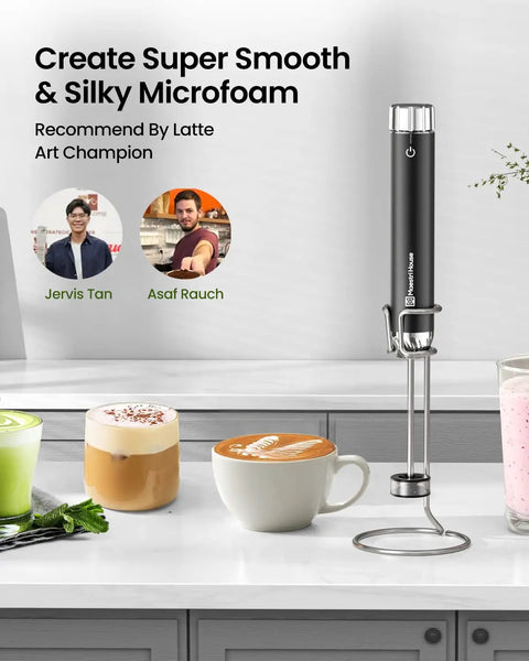 LunaFro Art Rechargeable Handheld Milk Frother With No Steam Wand Stepless Speed Control on counter beside foamed drinks.