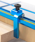 Five Pack Round Knobs Five Sixteenths By Eighteen Threaded Clamping Knobs For T Track And Table Saw Accessories Featherboards Woodworking Jigs On Miter Saw Router Table And Drill Press Durable Hand Grip Replacement installed on blue T-track clamp on wooden board