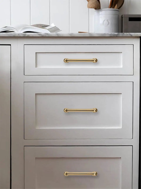 Premium Solid Brushed Brass Cabinet Pulls And Drawer Handles 3 Inch Hole Center on white kitchen drawers.