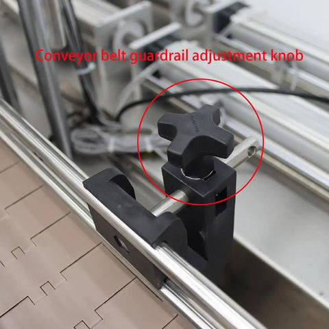 Conveyor belt guardrail adjustment knob for Built Like A Tank Automatic Pneumatic Liquid Paste Filler With Smooth Moving Conveyor Belt.