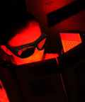 Kickass Laser Safety Goggles With Red Light Therapy Coverage And High Optic Density Certified Eyewear For Grease Monkey Shop Use And Fiber Beam Protection That Keeps Your Vision Rock Solid worn by a user in red light.