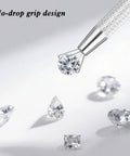 Close-up of Piercing Ball Grabber Tool Kit For Jewelry Changes Must Have Internal And External Threaded Inserts holding a gemstone.