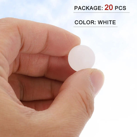 Hand holding a 5/8 inch solid white polypropylene bearing ball from a 20 pack, ideal for custom rig builds and DIY projects.