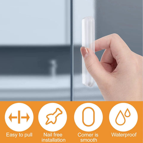 Mini Self Adhesive Clear Acrylic Cabinet Drawer Pulls 2 Pack No Punching Design Push Pull Handles attached to a glass panel