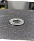 Built Different M6 Stainless Steel Belleville Washers 40 Piece Conical Spring Lock Plate Assembly on metal surface.