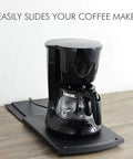 Total Kitchen Breeze Smooth Glide Appliance Roller Tray for Coffee Makers, black coffee maker on gray tray.