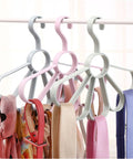 Fan Shaped Closet Rod Organizer For Ties Scarves And Hats Made From Sturdy Polypropylene holding scarves and ties in sky blue and pink.
