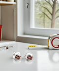 Drawer Slides Replacement Kit With Rollers And Guides, 4-Piece Set on a countertop beside measuring tape and tools