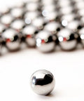 Get Top Shelf Performance With These Bad Ass High Precision G Twenty Five Grade Chrome Steel Ball Bearings Measuring One Point Five Inch In Diameter Hot Forged For Ultimate Durability And Reliability Perfect For Heavy Duty Applications, close-up of chrome steel ball bearing.