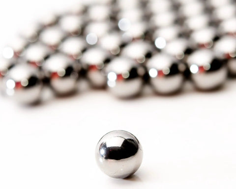 Get Top Shelf Performance With These Bad Ass High Precision G Twenty Five Grade Chrome Steel Ball Bearings Measuring One Point Five Inch In Diameter Hot Forged For Ultimate Durability And Reliability Perfect For Heavy Duty Applications, close-up of chrome steel ball bearing.