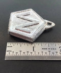 Replacement Pendulum Bob For Antique Clock Nonadjustable Two Point Five Ounce Reproduction DIY Kit next to ruler