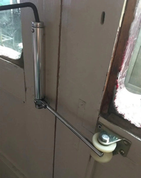 Heavy Duty U Channel Sliding Gate Rollers With Precision Nylon Bearings Rock Smooth Glide Build For Inverted Track Doors And Shop Equipment Built Tough For Hassle Free Sliding And Zero Vibration 4 Inch 2 Pack installed on a door.