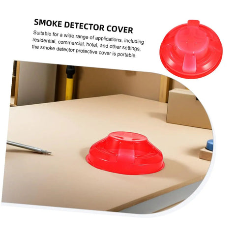 Tough Plastic Smoke Alarm Covers Four Pack Waterproof Dust Protector Shield Keep Kitchen Detectors Spotless Hassle Free Easy Snap On Grease Guard For Busy Kitchens on a table.