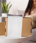 100 Piece White Epe Foam Cushion Wrap protecting pouches on a cardboard box for safe transit of fragile items.