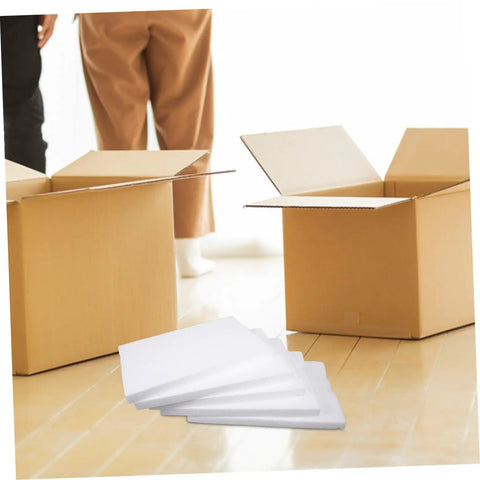 Top Shelf White Foam Board Packing Inserts For Shipping Cushion Protection Reusable Packaging Liners on floor with cardboard boxes.