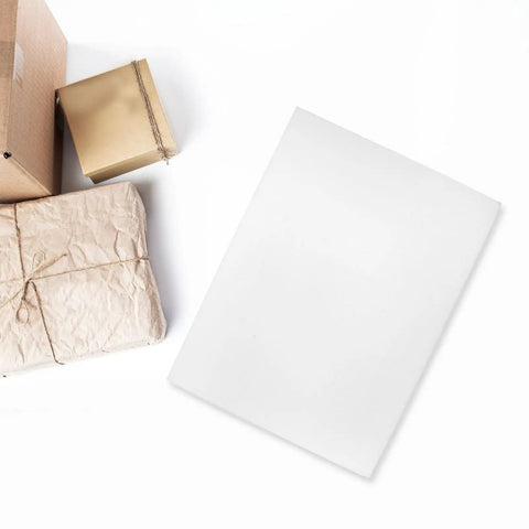 Two Piece High Density Polyurethane Foam Sheets Hard As Nails Cuttable Cushioning Pads Wear Resistant Foaming Board next to wrapped packages.