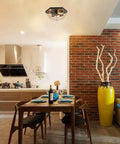 Brass Industrial Flush Mount Ceiling Light 3 Light Square Cage Fixture in Black and Gold installed in a modern kitchen dining area.