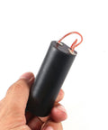 Hand holding High Voltage Boost Module From 3V To 6V Input To 400kV Output Two Pack DC Step Up Power Transformer for lab projects.