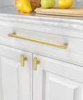 Heavy Duty Brushed Gold Knurled Cabinet Pulls 10 Inch Hole Center Handle Set on white kitchen cabinetry with fruit.