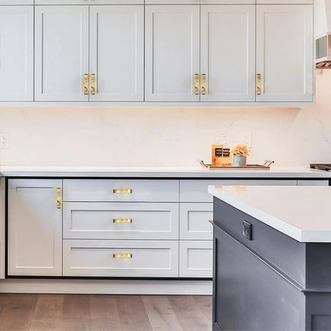 10 Pack Brushed Gold Cabinet Pulls Featuring A 3 Inch Center Hole Ideal For Kitchen Drawers And Bathroom Vanities, installed on gray cabinets.