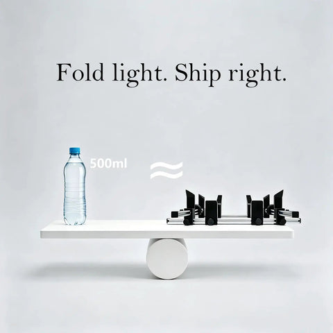 Premium Grade Manual Box Folding Tool For Shipping Cartons And Corrugated Packaging Adjustable Size Setup Jig With Brushed Aluminum Frame on a table next to a water bottle.
