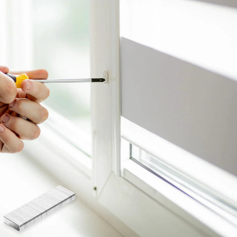 Close-up of Tough As Nails Plantation Shutter Repair Staples Kit with louver tab installation on window frame.