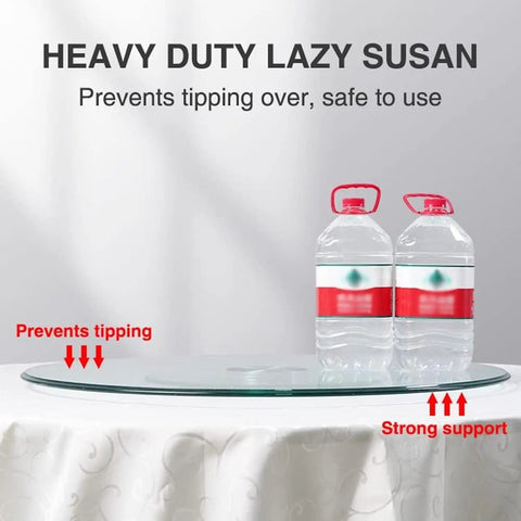 Real Deal Tempered Glass Lazy Susan Rotating Turntable Slick Bearing Swivel Serving Tray For Modern Kitchen And Dining Table Clear Glass Platter Eighty Inch Diameter on a table holding two water bottles.
