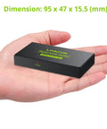 Slick 1X4 Toslink Optical Audio Splitter in hand, compact size, sturdy aluminum material for easy home theater setup.