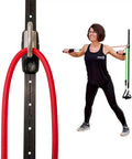 Woman using Space Saving Wall Mount Gym Anchor System With 4 Stackable Resistance Bands adjustable rail for workouts.