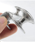 Close-up of Stainless Steel Glass Door Pull Handles Set Of 2 For 5 To 8mm Glass Thickness 28mm Round Knobs shown in hand.