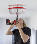 Person using Adjustable Hole Saw Cutter Kit From One And Five Eighths Inch To Eight Inches With Twin Blade And ABS Dust Shield for ceiling cutout