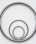 Premium Thin Section Ball Bearing With Integrated Seal Straight Up Precision Angular Contact Design Heavy Duty Build For Robotics And Automation 110 By 126 By 8 image showing three thin section ball bearings.