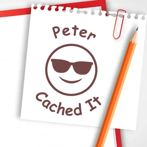 Stamped notebook with "Peter Cached It" from Geocache Found Log Stamp Kit Self-Inking 3/4 Inch Stamp With 11 Vibrant Ink Colors.