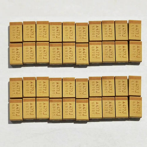Twenty Pack Of Pro Grade Tantalum Capacitors Brings Serious 470 UF And 6.3 Volt Juice To Your Rig For Smooth Smd 7343 Circuit Mods And Everyday Gear Upgrades, displaying rows of identical capacitors.