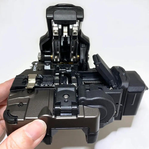 Professional Grade Fiber Optic Cutting Tool Featuring A Killer 28 Facet Blade That Slashes Through Up To Eighty Thousand Cuts Easy Wear Resistant Build Keeps It Rock Solid For Daily Single Dual Or Ribbon Fiber Installation Runs, showing detailed angle of the precision mechanism.