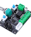 Stepper motor driver board with green screw-terminal blocks, blue adjustment knob, white connectors, black IC (top view).