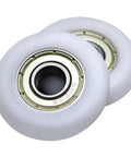 Slick Rolling 10x40x10mm Bearing Pulley With 6000ZZ Spherical Roller Nylon And Rubber Wheels Heavy Duty 4 Pack showing two white pulleys.
